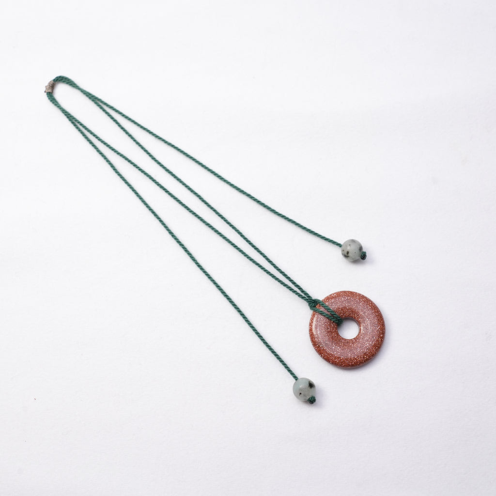Gold Sand Stone Peace Knot Necklace