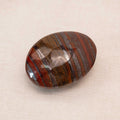 Iron Tiger Eye Stone Palm Stone representing serenity and courage
