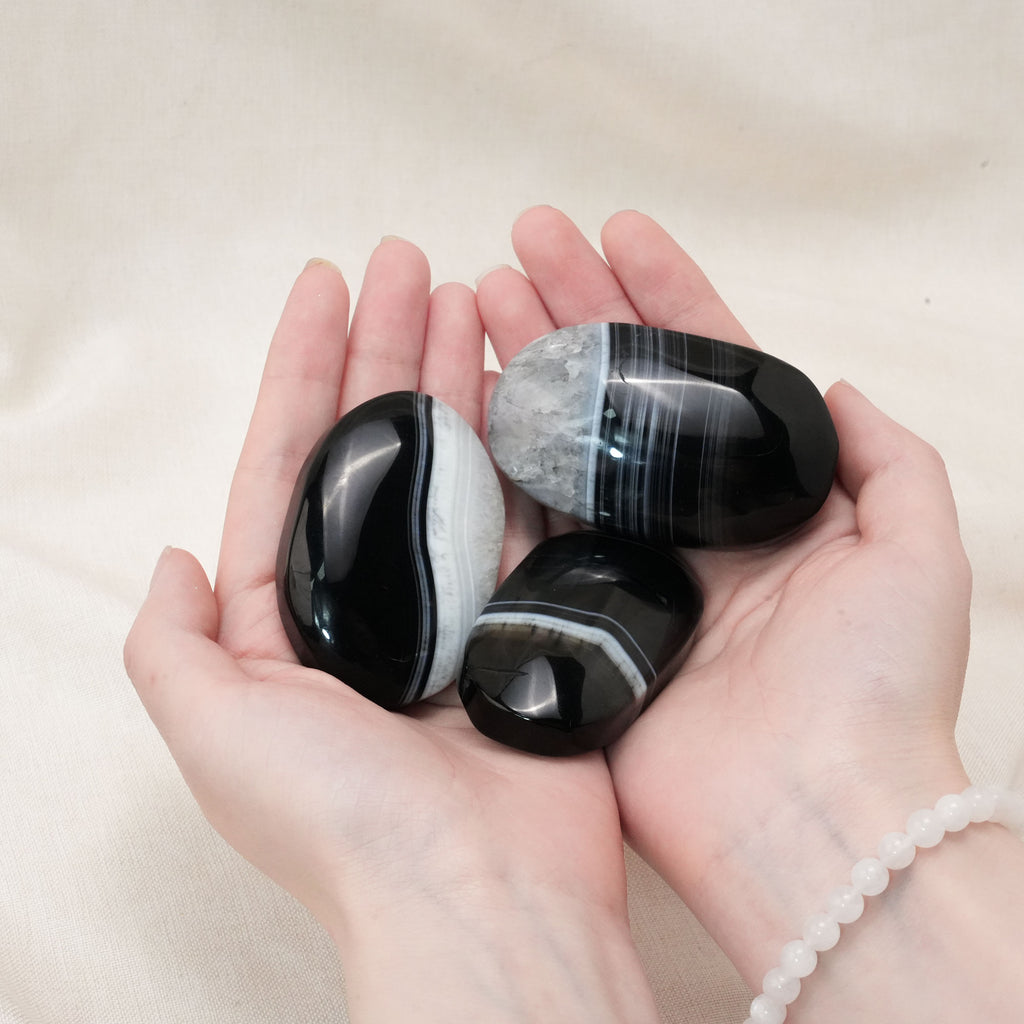 Handcrafted from natural agate, this palm stone promotes emotional stability and enhances spiritual growth