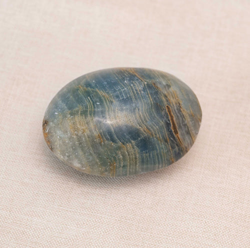 Blue Onyx Palm Stone with deep blue hues and natural patterns